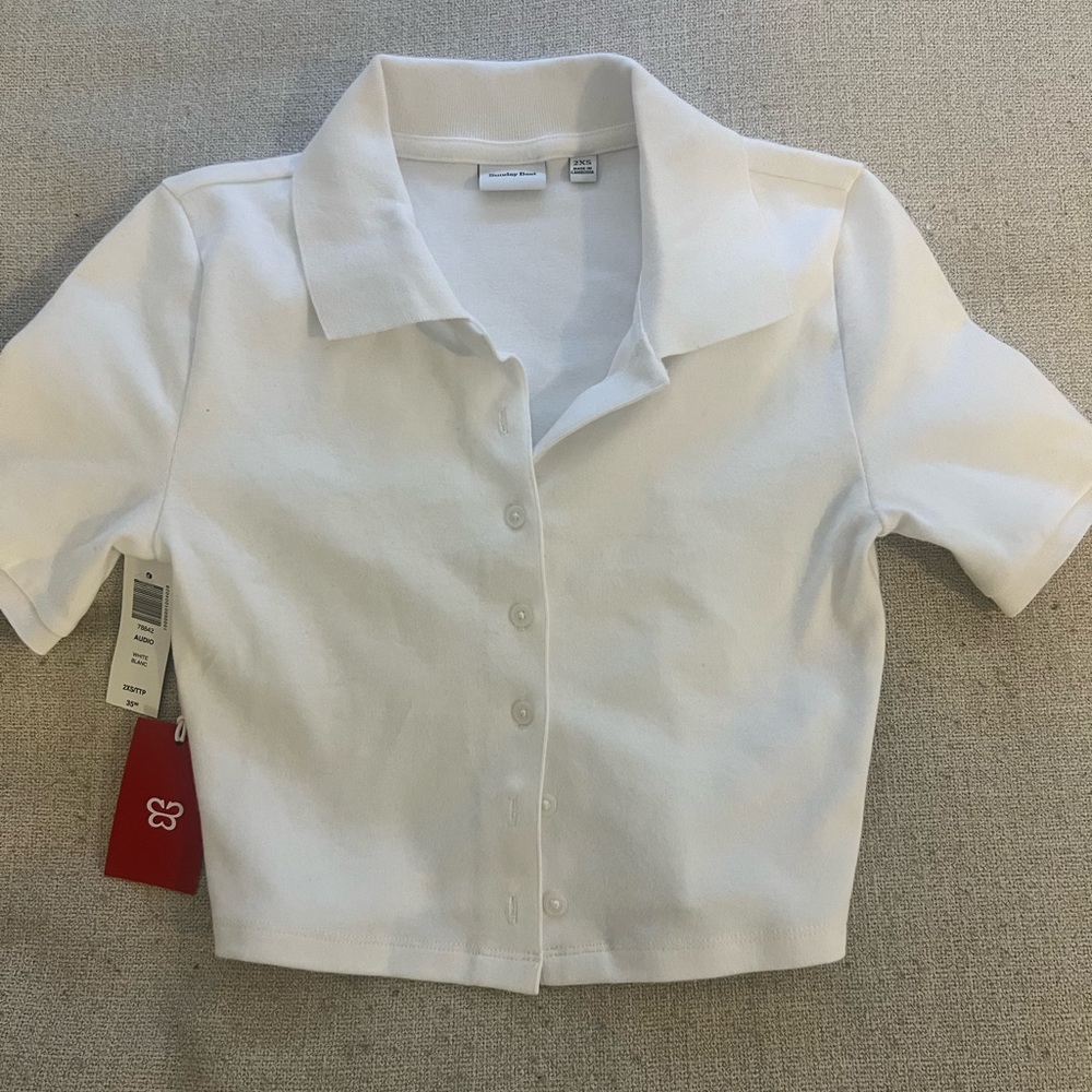 Sunday Best tags on polo shirt